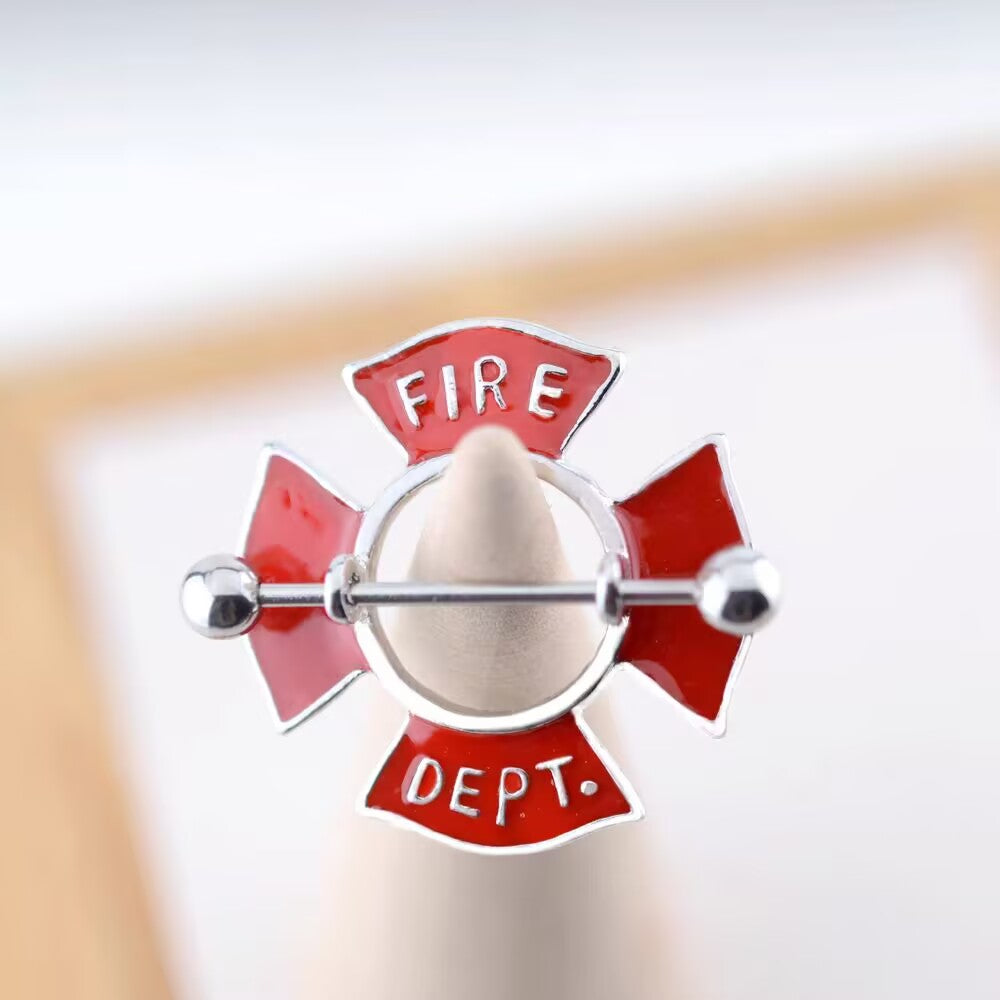 Close-up detail of the red enamel Fire Dept. shield piercing jewelry.