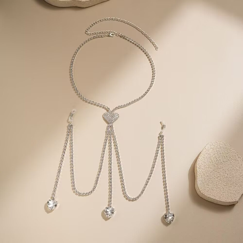Flat lay display of complete heart rhinestone body chain and non-pierced nipple clamp set