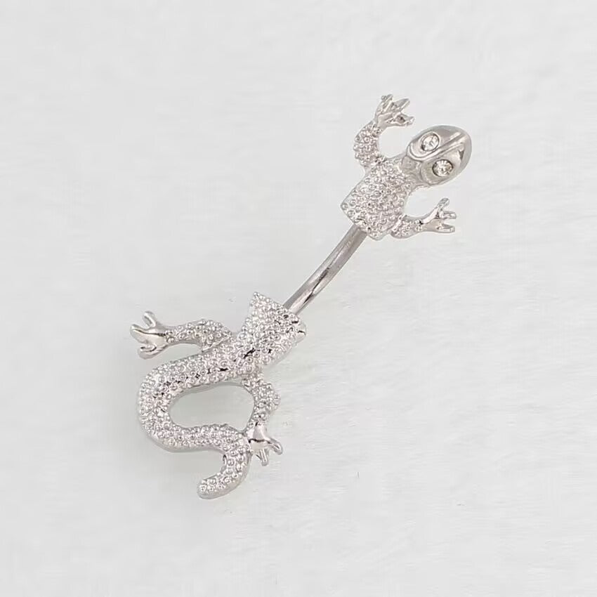 Clear crystal gem gecko belly button ring shown at a diagonal angle.