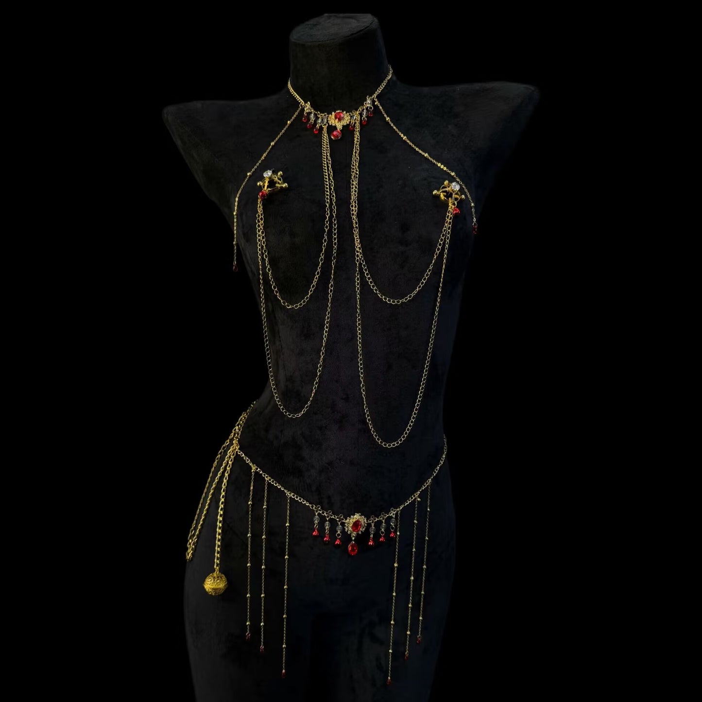Luxurious faux crystal shield breast rings with adjustable screws connected to a gold ruby filigree waist chain.