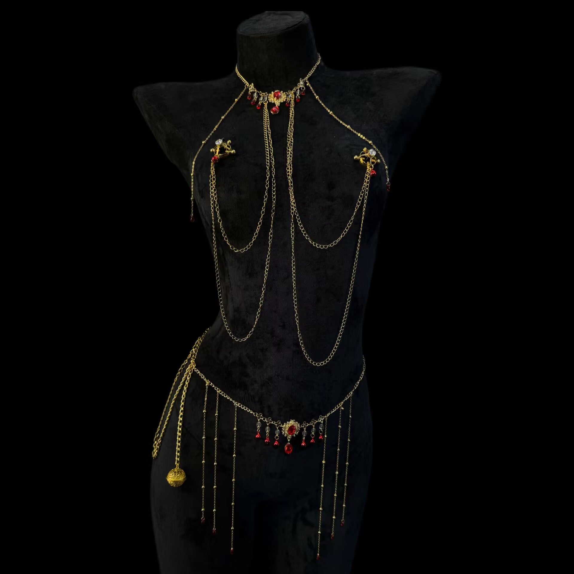 Luxurious faux crystal shield breast rings with adjustable screws connected to a gold ruby filigree waist chain.