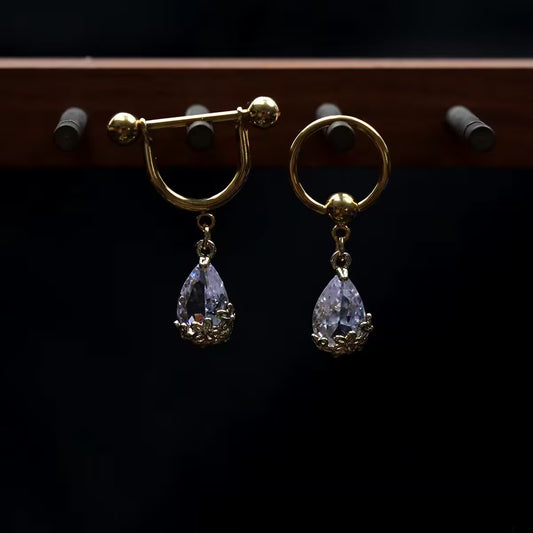 Gold tear drop crystal pierced nipple jewelry showing barbell shield and captive bead ring styles