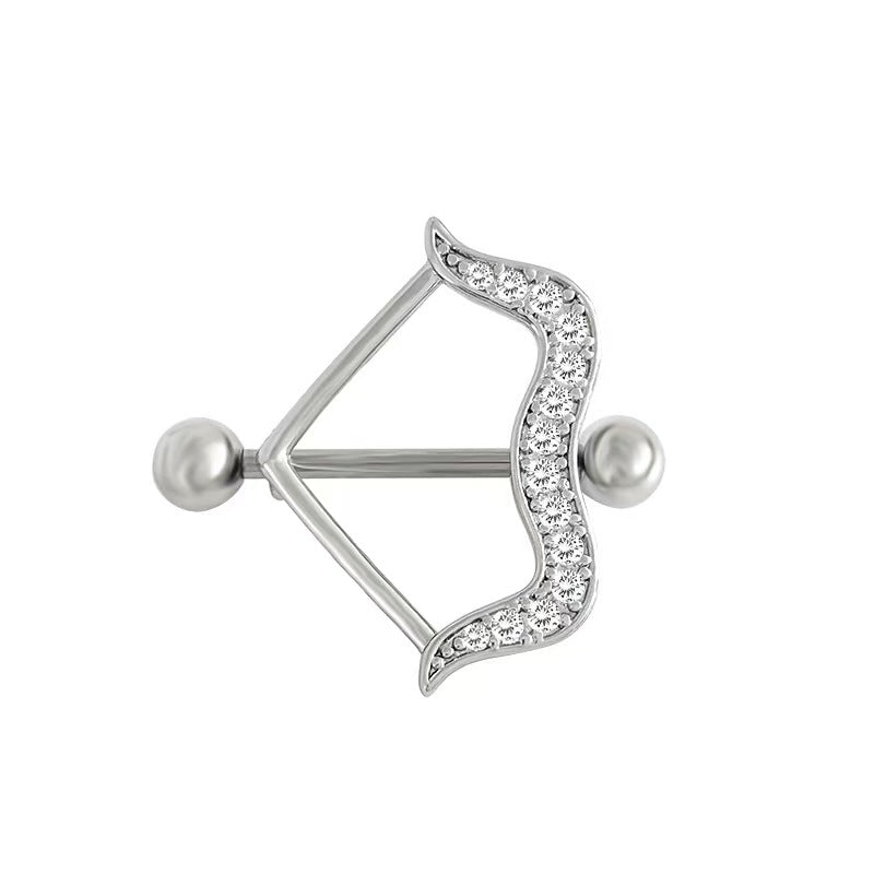 Silver cupid's bow nipple shield piercing jewelry with embedded crystals on a pure white background, ideal for coquette and whimsigoth body aesthetics.