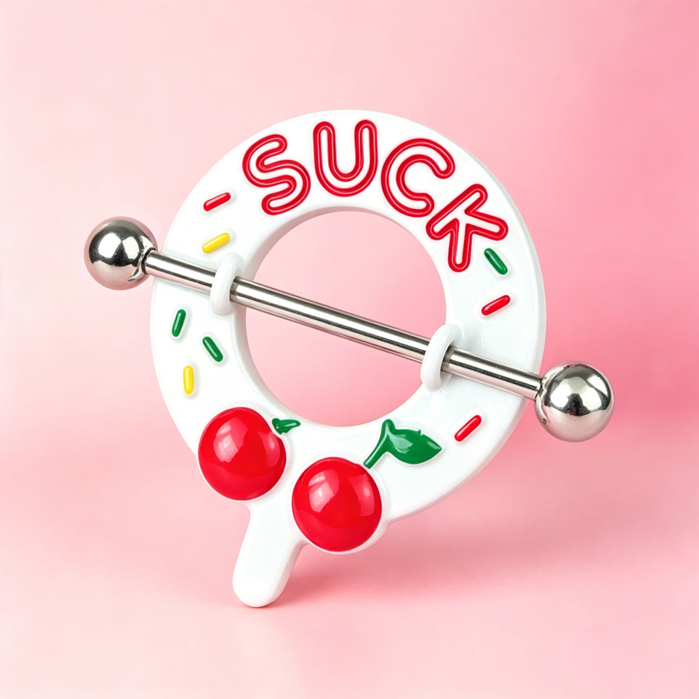 Close up shot of the unique cherry nipple barbell shield displayed on a soft pink background for aesthetic alternative lifestyle jewelry.