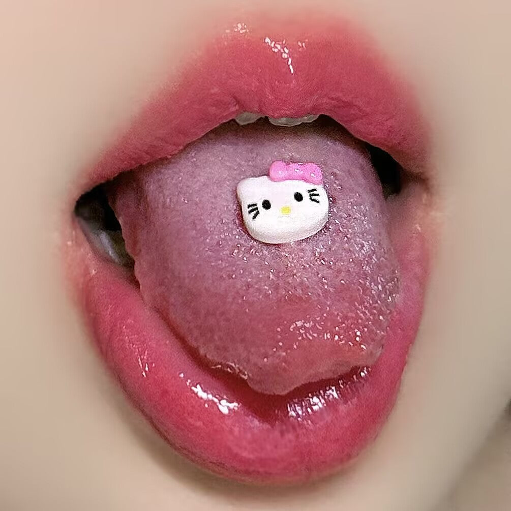 Cute white kitty tongue ring barbell worn on tongue showing adorable Y2K piercing jewelry style.