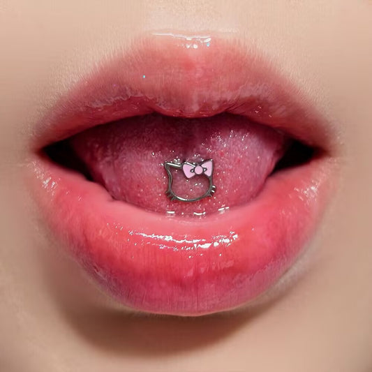 Cute hollow kitty silhouette tongue ring with a pink bow worn on tongue