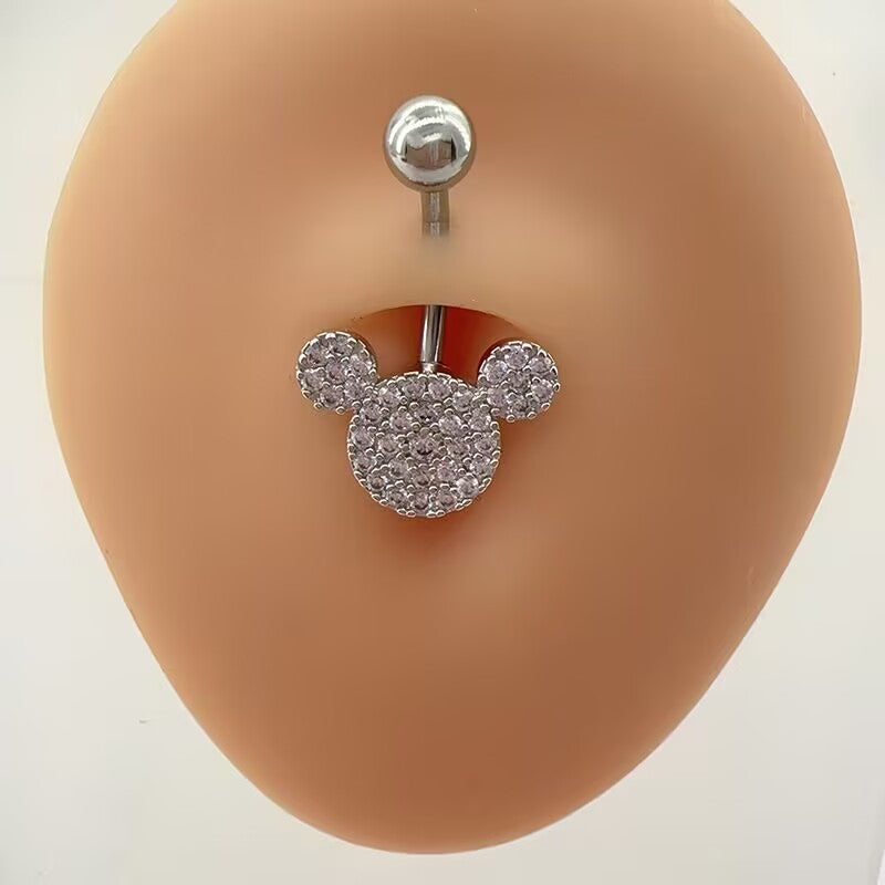Close-up view of a cute pave CZ mouse silhouette curved navel ring showing high-shine sparkle and standard curved barbell design.
