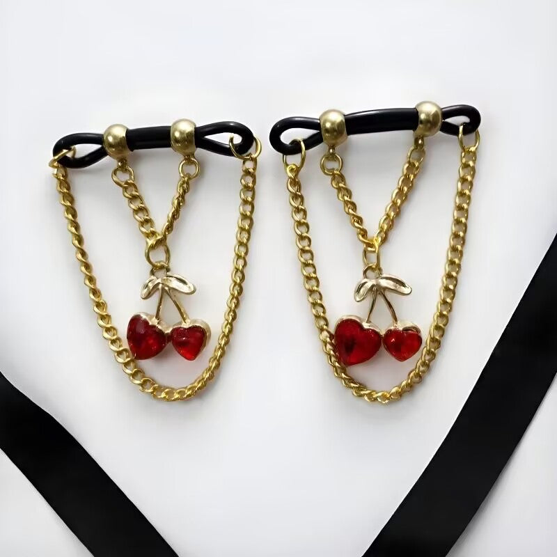 Dangle fake nipple rings with cute double red heart cherry charms and gold body chain accents.