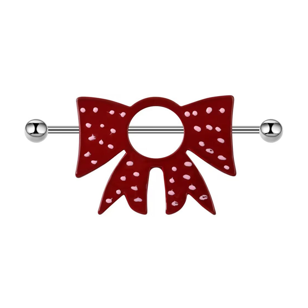 A single dark red bowknot nipple shield with pink polka dots and a 14G silver straight barbell on a pure white background.