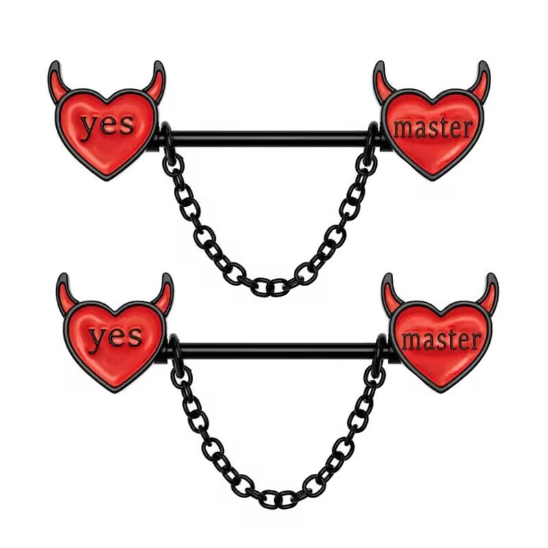 A pair of black nipple barbells featuring red enamel devil hearts with "yes" and "master" text and hanging chains.