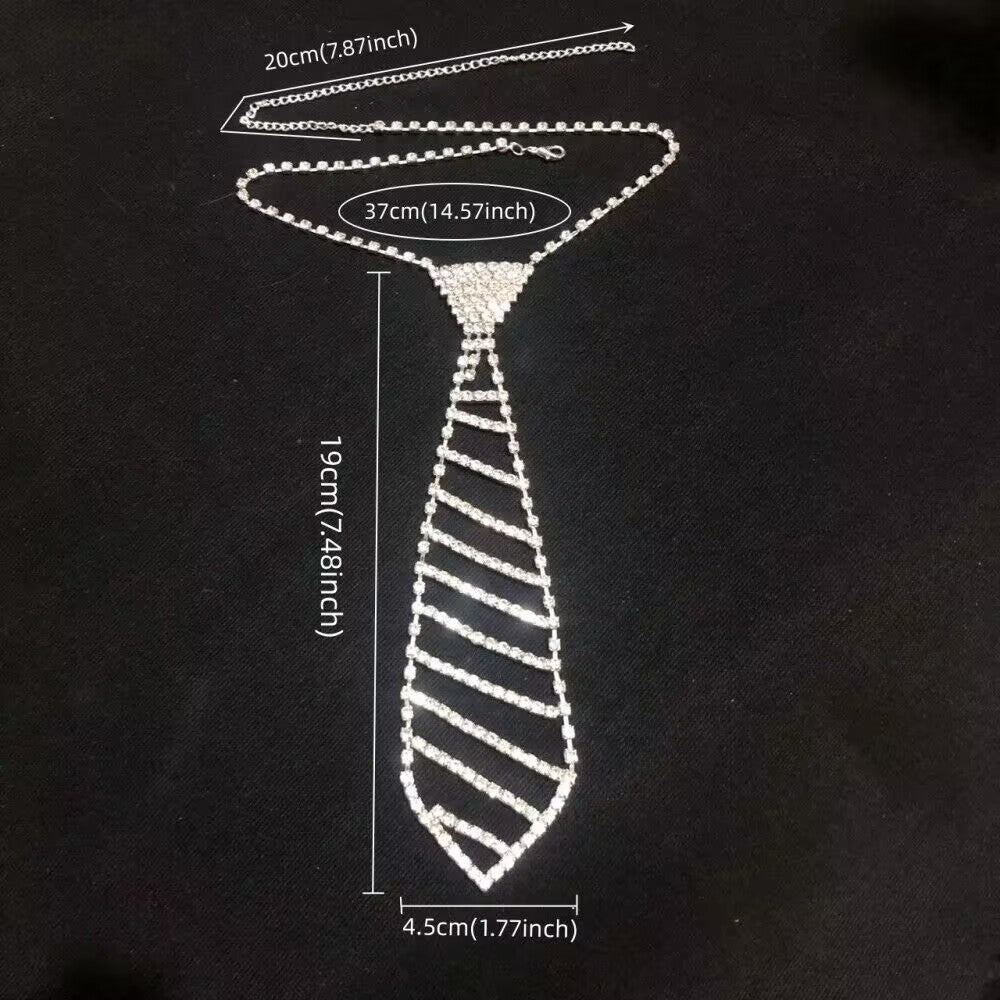 Diagonal stripe style rhinestone necktie necklace with clear centimeter and inch measurement markers.
