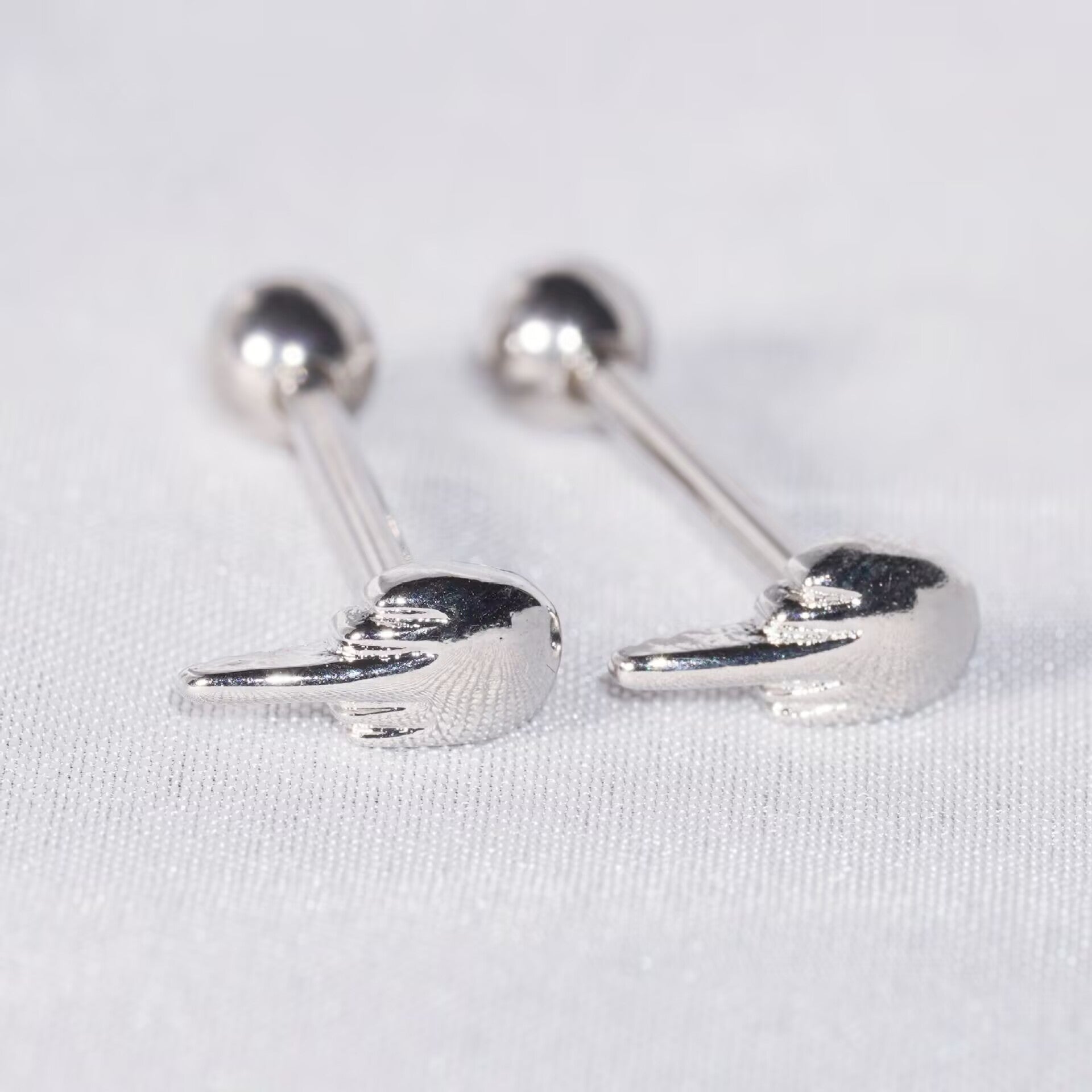 Two middle finger hand gesture barbells showing top detail and back screw ball.