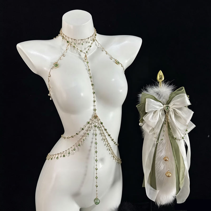 Front view of emerald green body jewelry chain harness with faux fur ribbon tail plug accessory