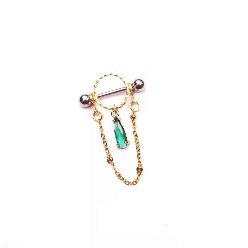 Isolated view of emerald green waterdrop CZ nipple shield ring with chain on seamless white background.