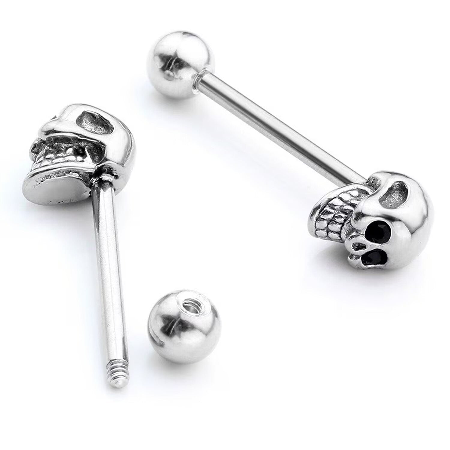 Detailed view of an unscrewed skull tongue ring showing the threaded bar and round ball.