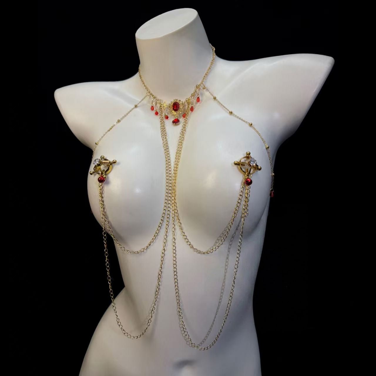 Brilliant faux crystal shield clamps simulating a realistic pierced breast jewelry look on a vintage body chain.
