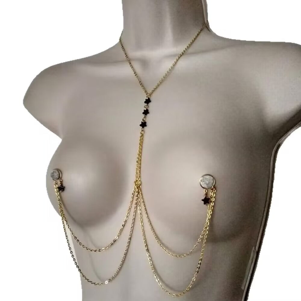 Model wearing aesthetic chest chain body jewelry at a summer music festival.