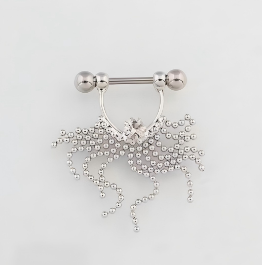 Fluid waterfall effect of the flexible beaded fringe on a dangling nipple ring, illustrating its soft and dynamic movement.