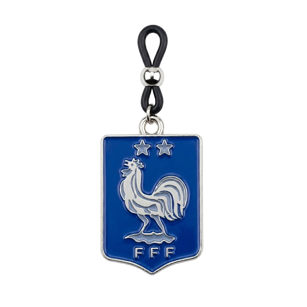 A single non-pierced nipple clamp featuring a blue France Football FFF shield pendant with the Gallic Rooster and two stars, attached to an adjustable black rubber loop with a silver sliding bead.