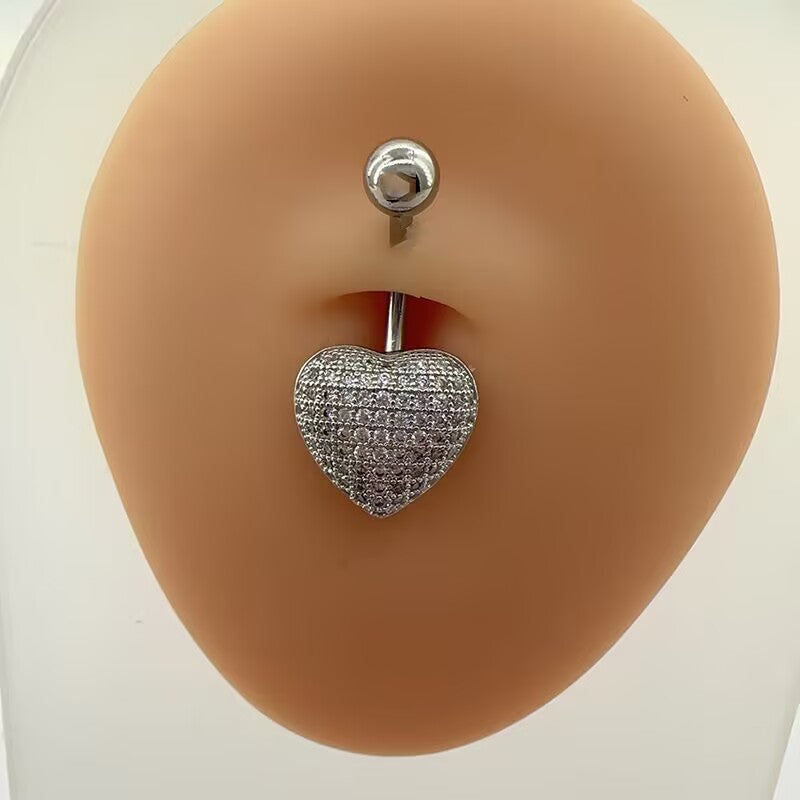 Front view of a full pave cz love heart navel ring with curved barbell