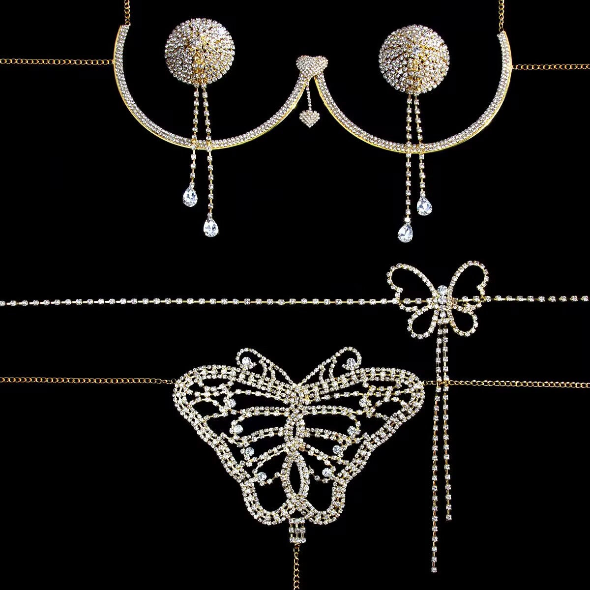 Flat lay of gold rhinestone crystal body harness set with heart breast bracket and butterfly waist chain on black background.