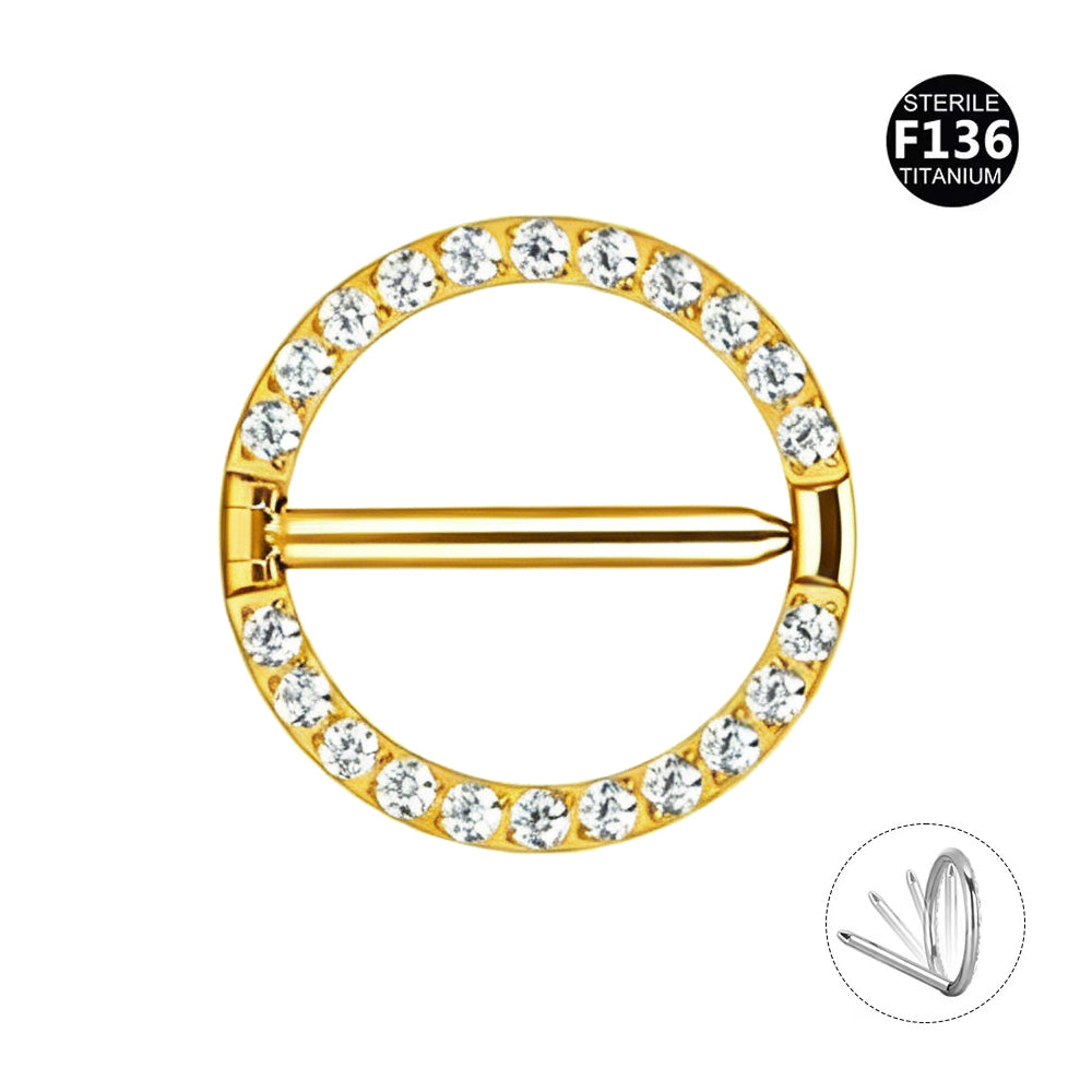Gold anodized F136 titanium round nipple shield ring with brilliant CZ crystal paving, featuring an inset diagram showing the hinged segment clicker mechanism.