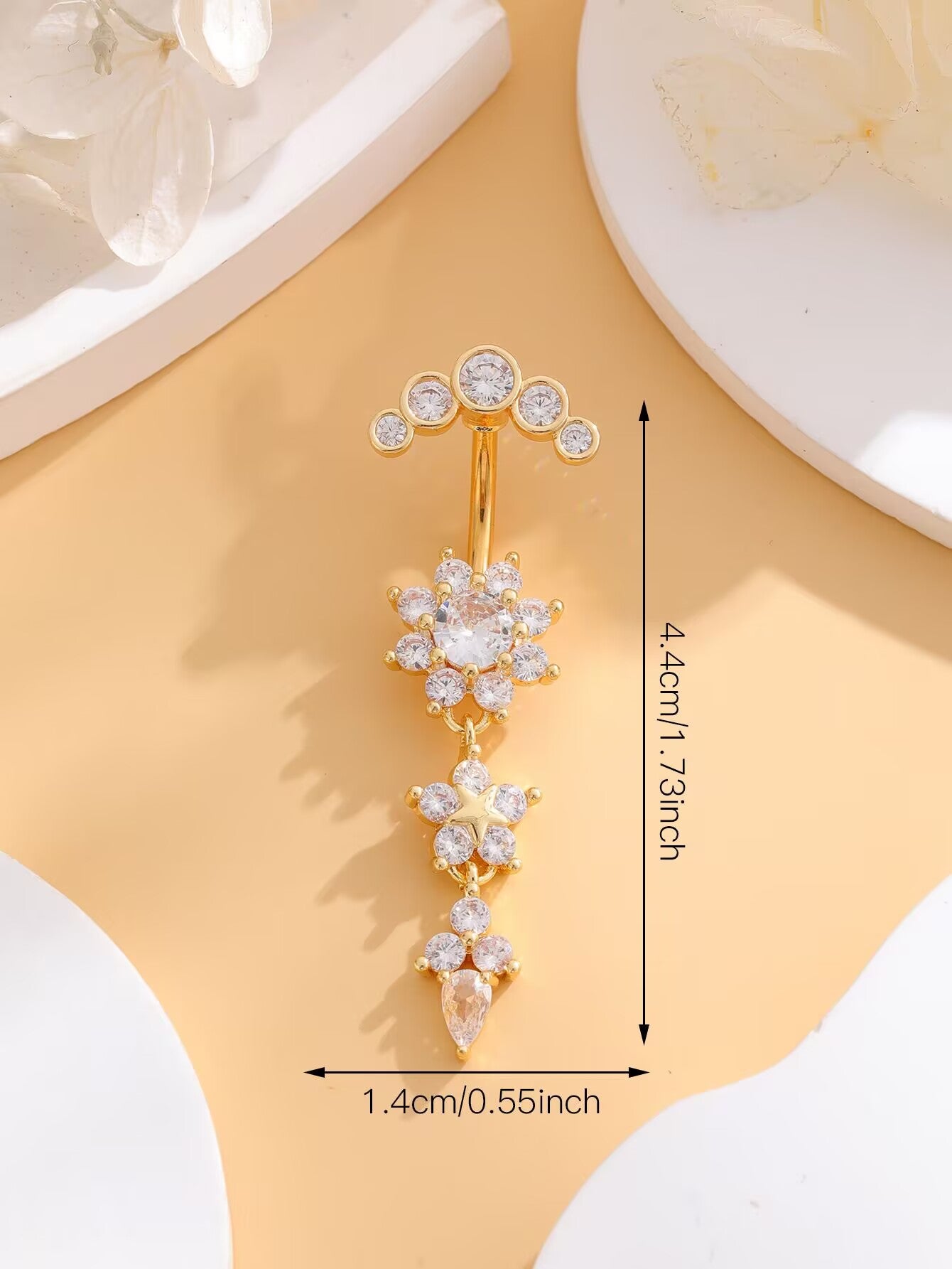 Gold flower dangle belly button ring dimension chart detailing 1.73 inch length and 0.55 inch width.