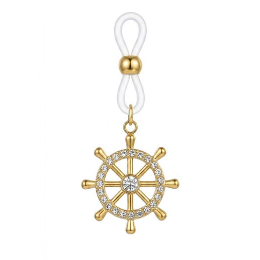 A high-definition close-up shot of a single gold non-piercing nipple ring featuring a nautical ship wheel pendant paved with sparkling crystal rhinestones, hanging from an adjustable white silicone loop on a pure white background.