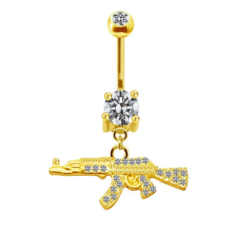 Luxury 14k gold plated belly ring featuring a brilliant 4-claw solitaire diamond crystal and rhinestone gun charm.