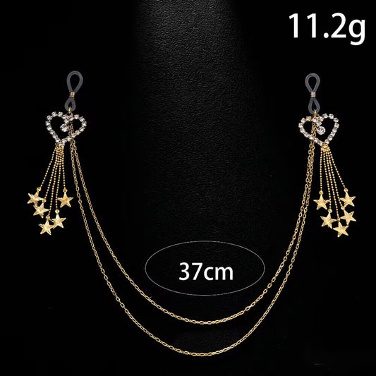 Product display of a gold rhinestone heart non-piercing nipple chain set with star tassels against a black background, indicating a total weight of 11.2g and a length of 37cm.