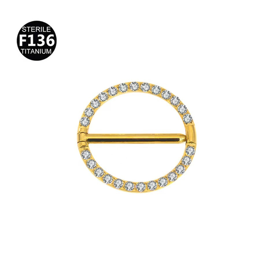 Luxurious gold coated F136 titanium round hinged clicker nipple ring embellished with sparkling cubic zirconia crystals.