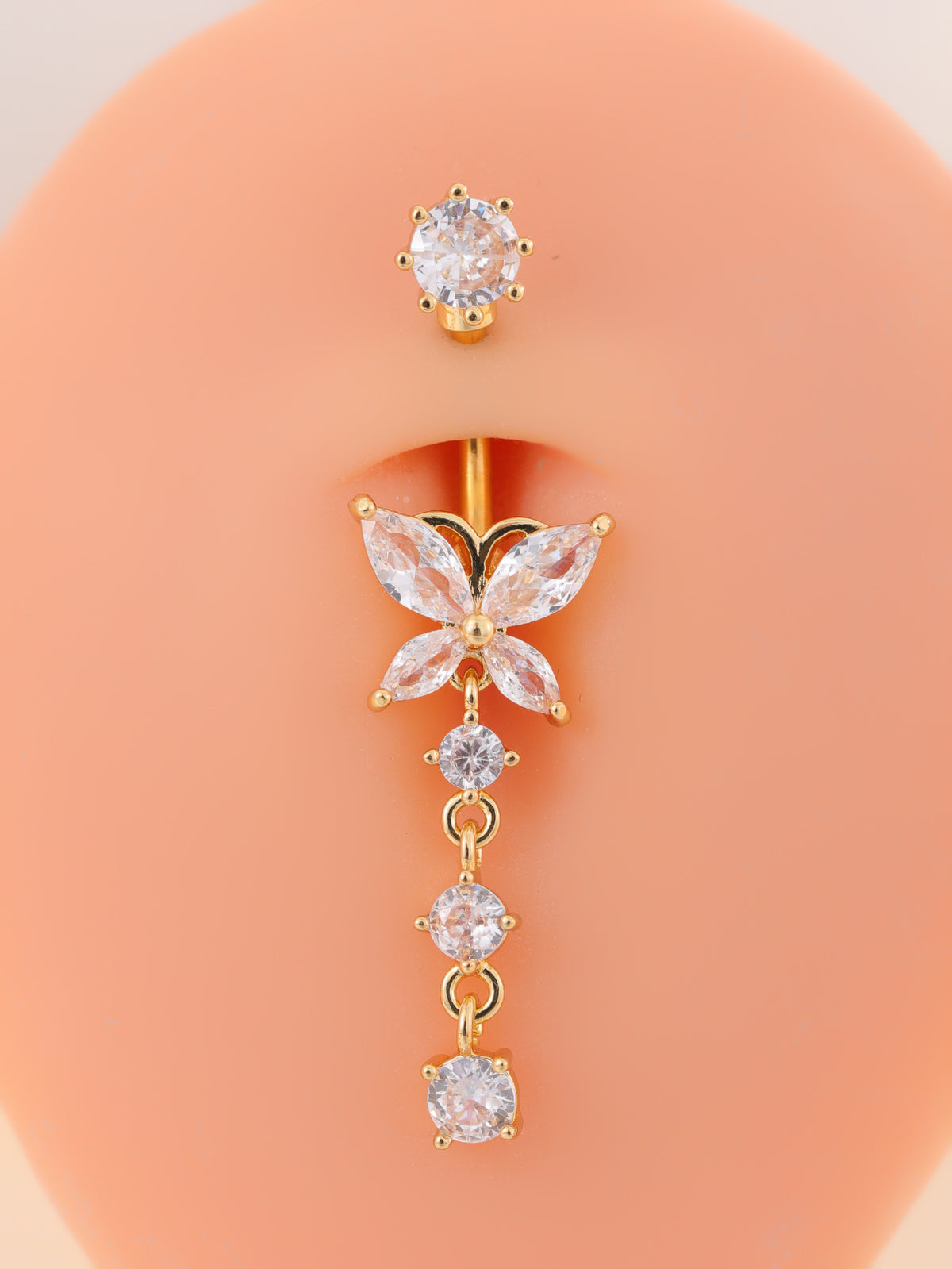 Single gold-tone butterfly navel ring with marquise wings and three dangling stones