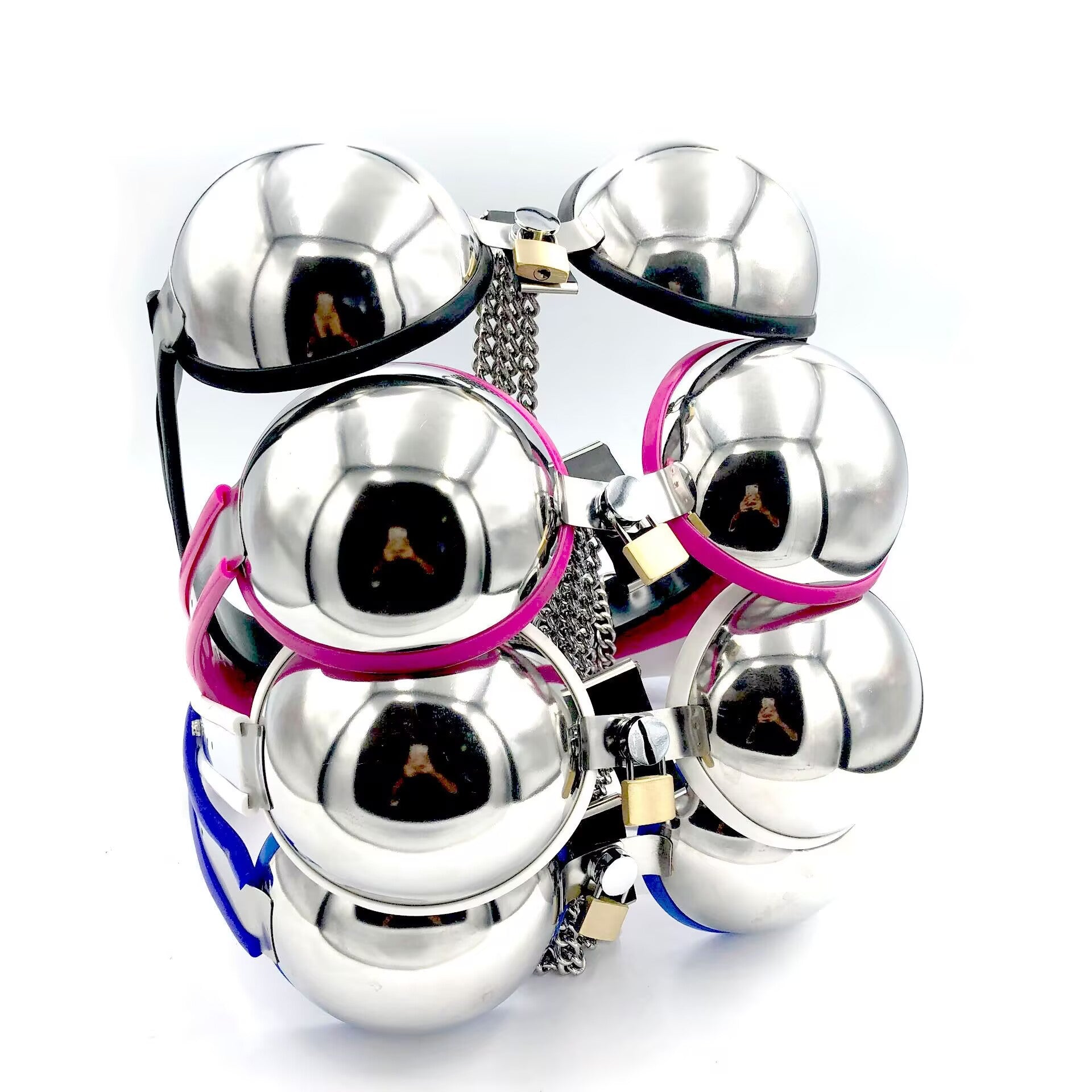 Stacked group of alternative fashion lockable metal bras available in black, white, pink, and blue trim colors.