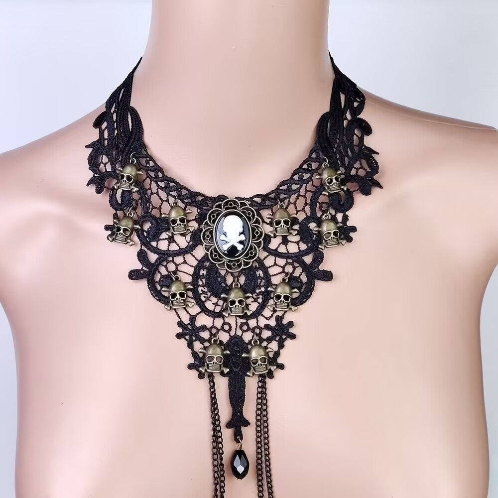 Goth punk style lace choker decorated with multiple small skull charms and non pierced nipple chain attachments.