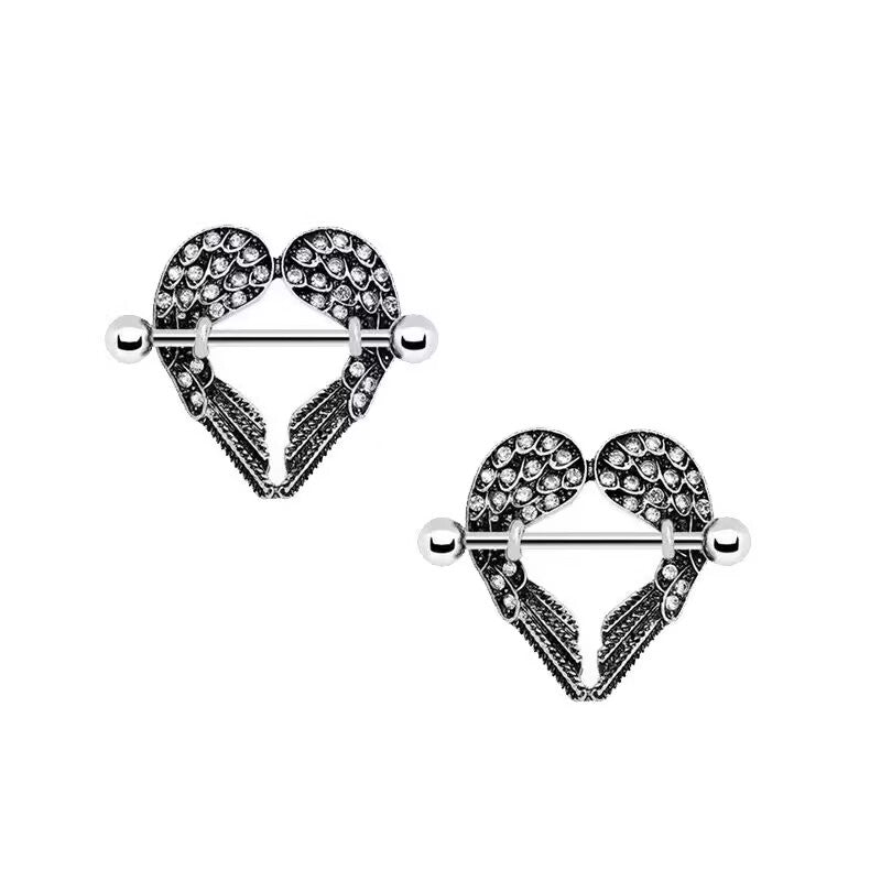 Professional white background shot of two crystal angel wings heart nipple barbells.