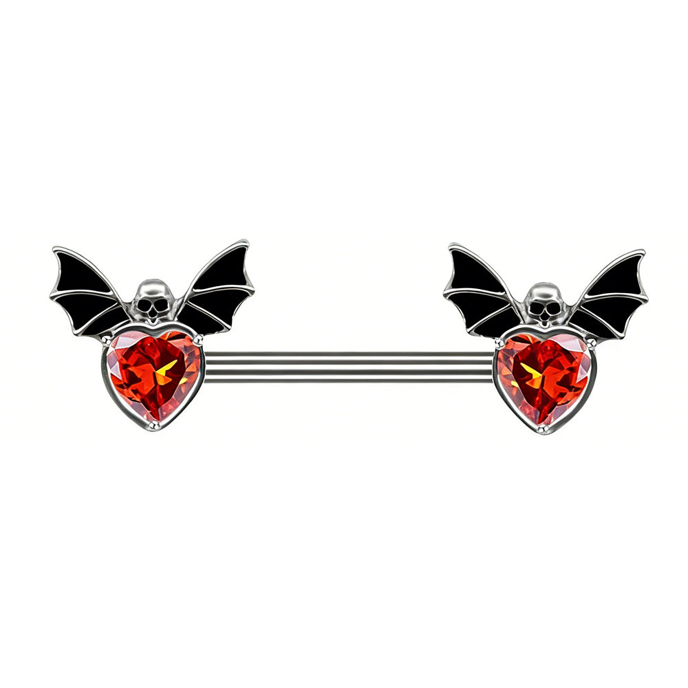 Front view of a gothic-style nipple shield barbell featuring stylized black bat wings and a sparkling faceted red heart-shaped gemstone, isolated on a white background.