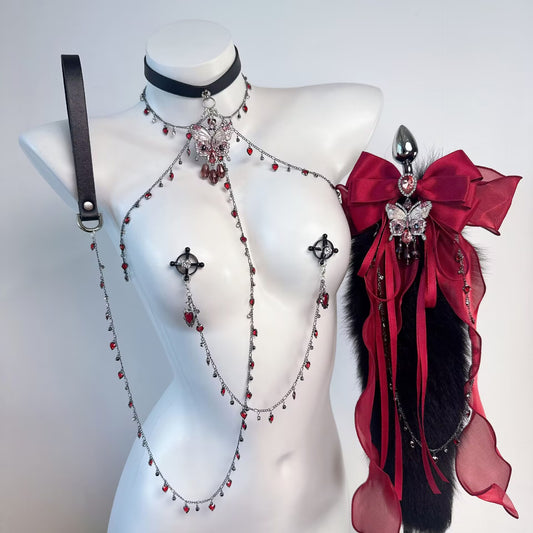 Gothic butterfly choker shoulder chain harness set with non pierced nipple clamps and red crystal accents on mannequin