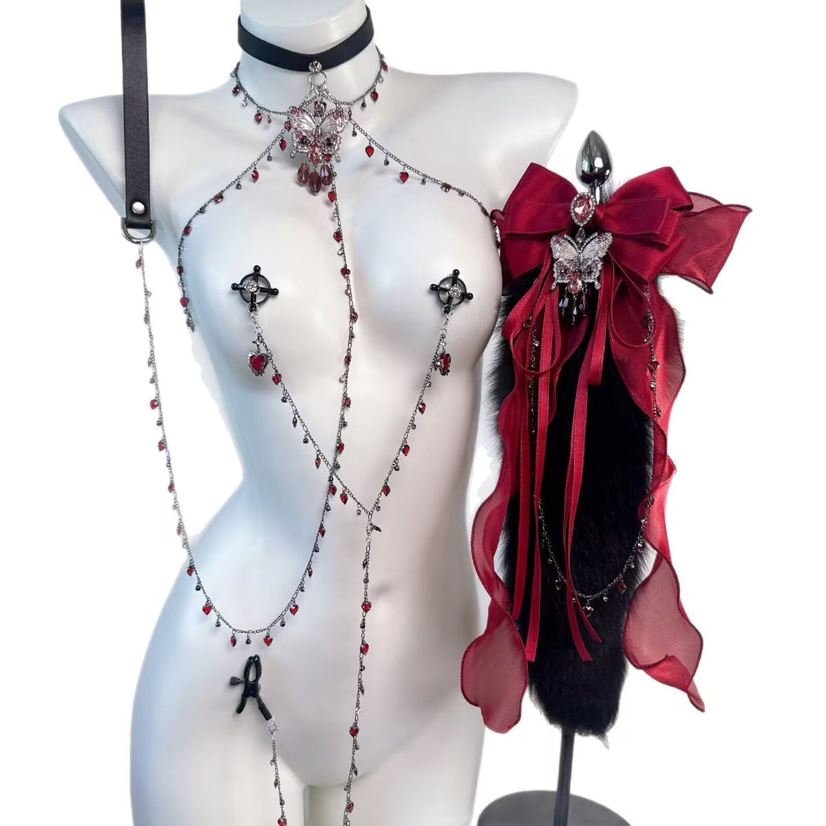 Full front view of gothic choker shoulder chain, non-pierced nipple jewelry, and bow tail plug accessory
