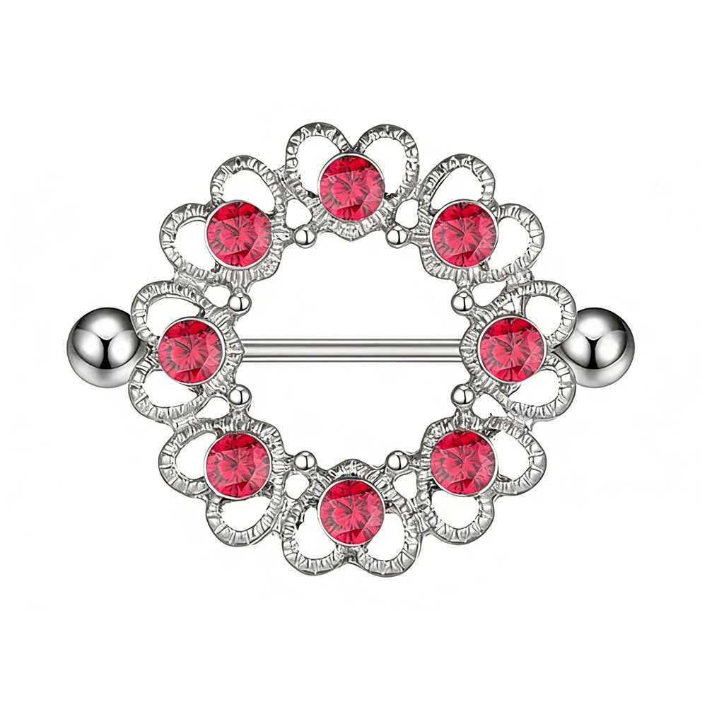 A single silver nipple shield featuring a hollow heart pattern and eight round red crystals on a white background.