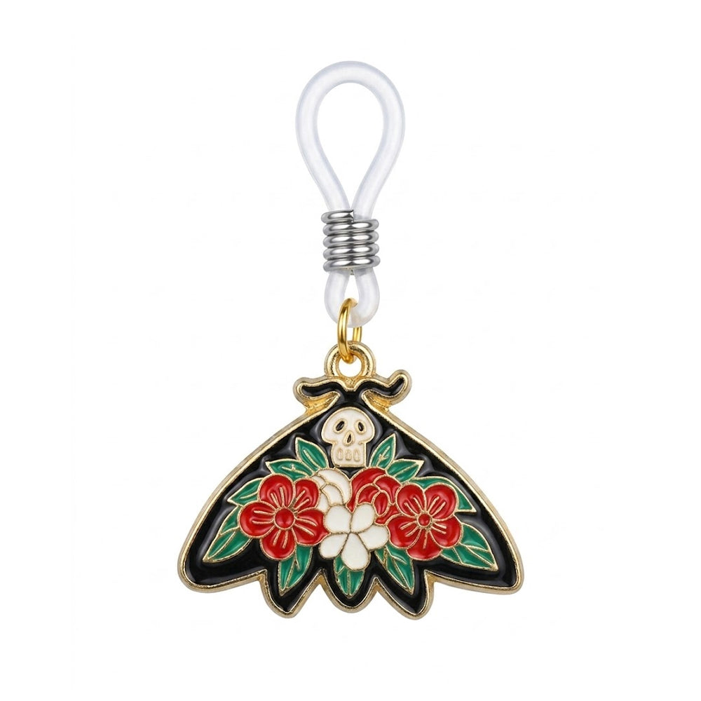 Single gothic moth nipple clip with skull and red floral enamel on a white background.