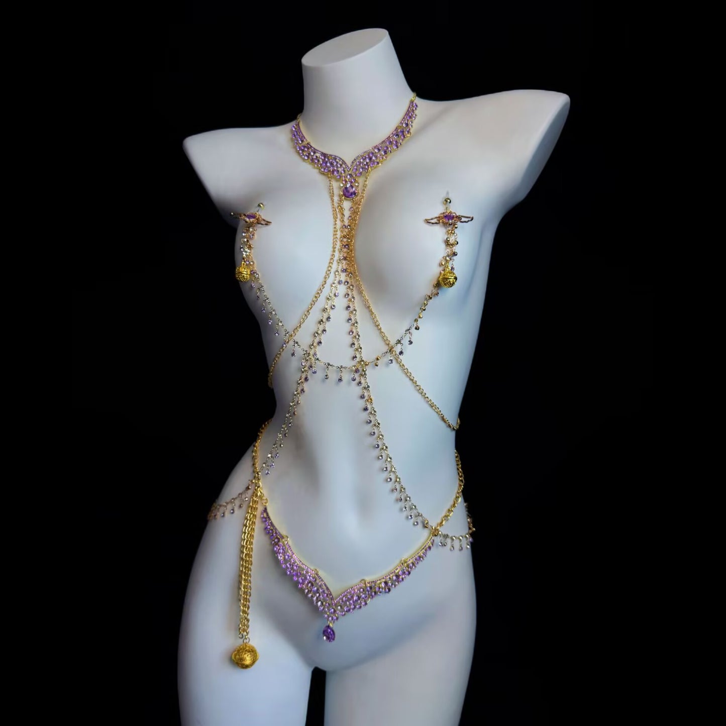Gothic purple crystal body chain harness set displayed on a mannequin featuring pierced nipple rings and a matching waist chain.