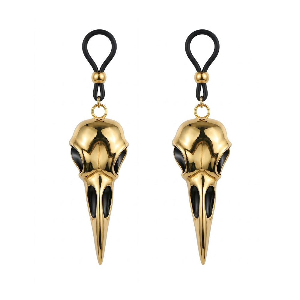 A pair of adjustable fake nipple rings featuring matching golden bird skull charms for gothic and alternative fashion, shown on a white background.