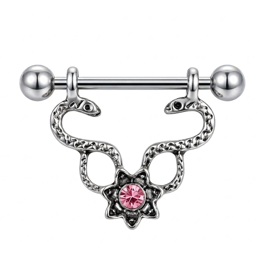 A single silver-toned Gothic nipple shield featuring two symmetrical snakes and a bright pink starburst crystal center on a white background.