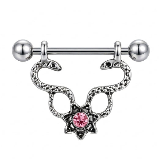 A single silver-toned Gothic nipple shield featuring two symmetrical snakes and a bright pink starburst crystal center on a white background.