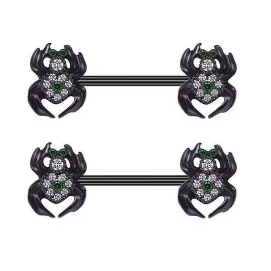 Front view of two black spider-shaped nipple barbells with emerald green and clear crystal details on a white background.