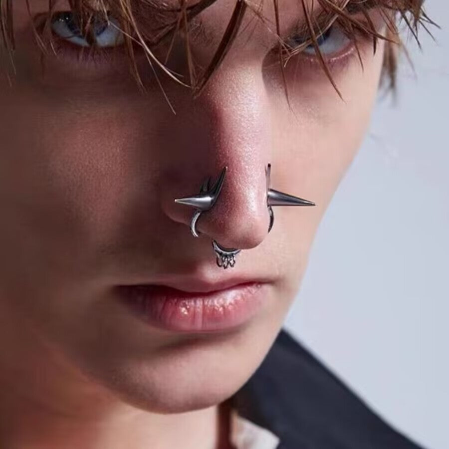 Side view of a model wearing a gothic spike double nose cuff non-piercing fake septum ring