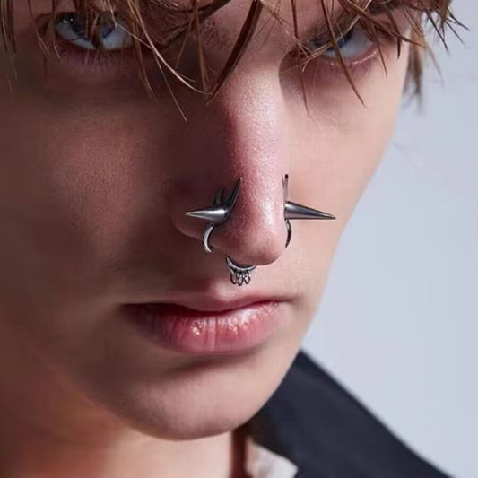 Side view of a model wearing a gothic spike double nose cuff non-piercing fake septum ring