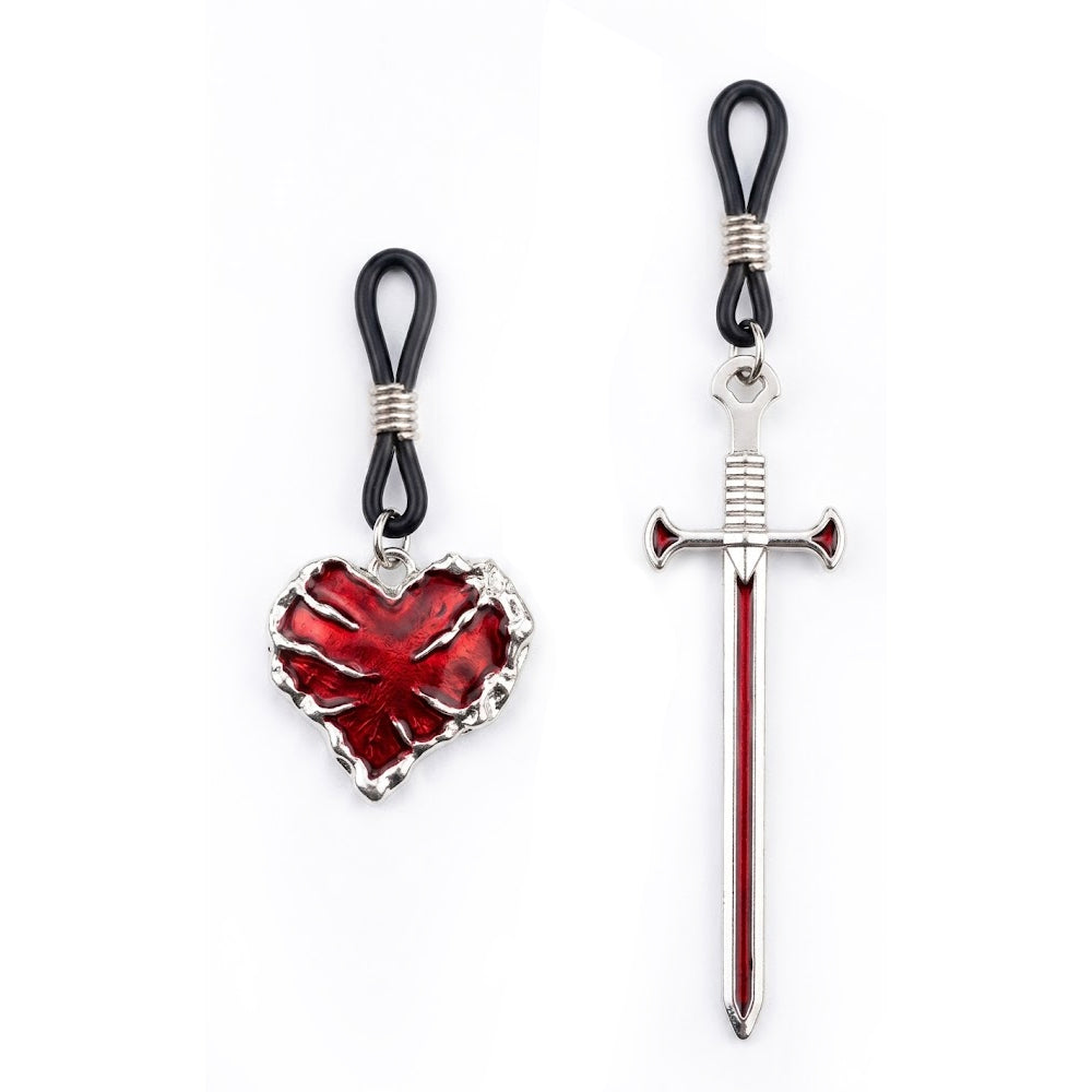 A set of two non-piercing nipple rings featuring a silver-toned medieval sword and a red bleeding heart charm on adjustable black loops.