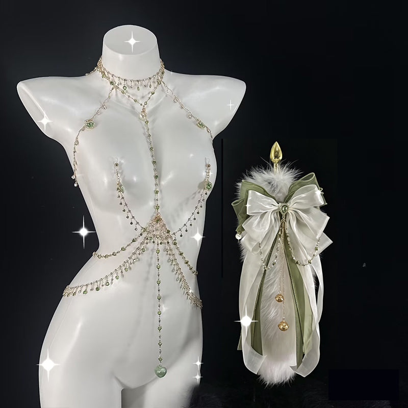 Green crystal body chain harness paired with a matching white plush tail plug accessory on mannequin