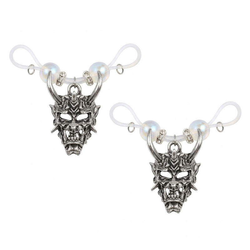 A pair of antique silver Hannya demon mask non-piercing nipple rings with clear adjustable silicone loops for clip-on body jewelry styling.